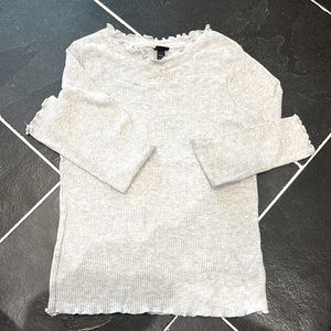 Thin long sleeve heather gray shirt w/ small ruffles around collar and sleeves.